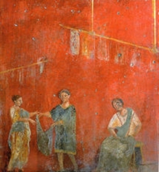 Mural de Pompeya que muestra a mujeres trabajando con un hombre en un comercio dedicado a la lavandería y a la tintorería (fullonica)